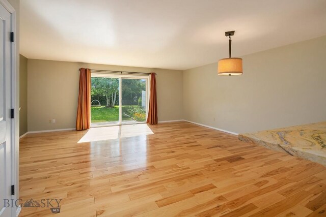 104 S Yellowstone Ave Unit 1, Bozeman, MT 59718 - unfurnished room with light wood finished floors and baseboards