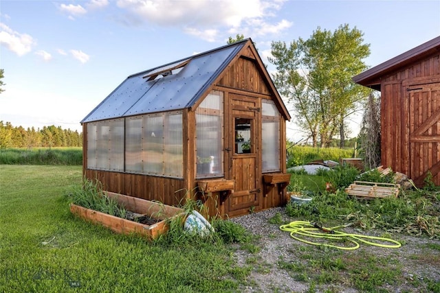 3573 Spain Bridge Rd, Belgrade, MT 59714 - view of greenhouse featuring a yard