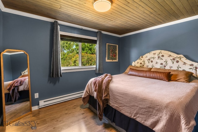 24151 Frontage Rd, Bozeman, MT 59718 - bedroom featuring a baseboard heating unit, ornamental molding, wood ceiling, and wood finished floors