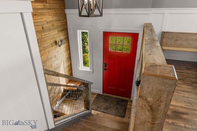 24151 Frontage Rd, Bozeman, MT 59718 - foyer featuring wood finished floors, stairway, and a chandelier