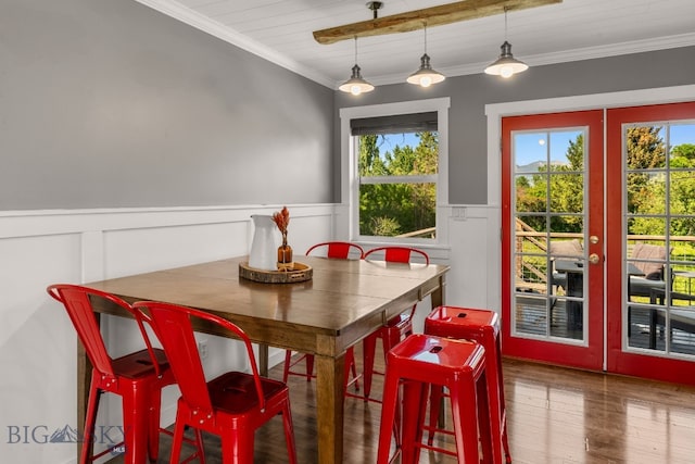 24151 Frontage Rd, Bozeman, MT 59718 - dining space featuring plenty of natural light, french doors, wood finished floors, a wainscoted wall, and a decorative wall