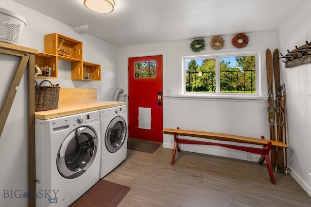 24151 Frontage Rd, Bozeman, MT 59718 - laundry area featuring washing machine and clothes dryer and cabinet space