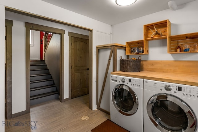 24151 Frontage Rd, Bozeman, MT 59718 - laundry room featuring washer and dryer and light wood-style floors