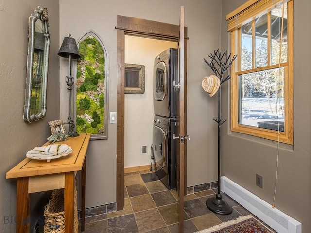 1255 Andesite Rd, Big Sky, MT 59716 - entryway with stacked washing machine and dryer and stone finish flooring