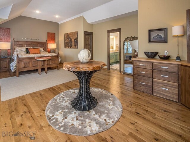 1255 Andesite Rd, Big Sky, MT 59716 - bedroom featuring light wood-style flooring, vaulted ceiling, recessed lighting, and ensuite bath