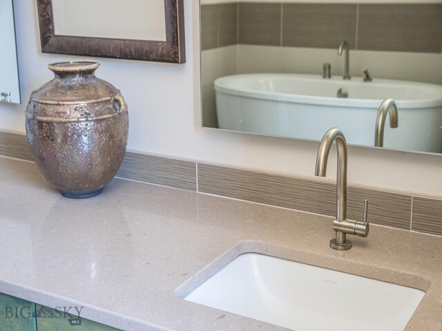 1255 Andesite Rd, Big Sky, MT 59716 - bathroom view of a freestanding tub and tasteful backsplash