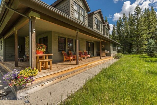 1255 Andesite Rd, Big Sky, MT 59716 - back of property with covered porch
