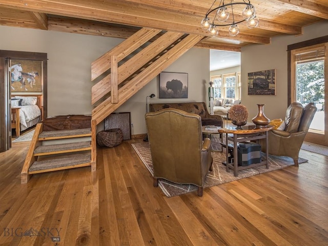 1255 Andesite Rd, Big Sky, MT 59716 - living area featuring hardwood / wood-style flooring, a chandelier, and a wooden ceiling with exposed beams