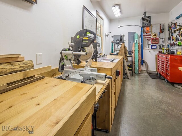 1255 Andesite Rd, Big Sky, MT 59716 - misc room with a workshop area, concrete flooring, and electric panel
