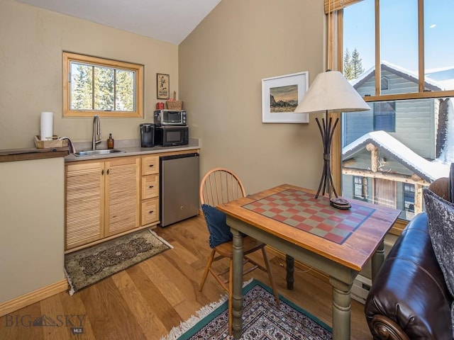 1255 Andesite Rd, Big Sky, MT 59716 - office with light wood-style flooring and lofted ceiling