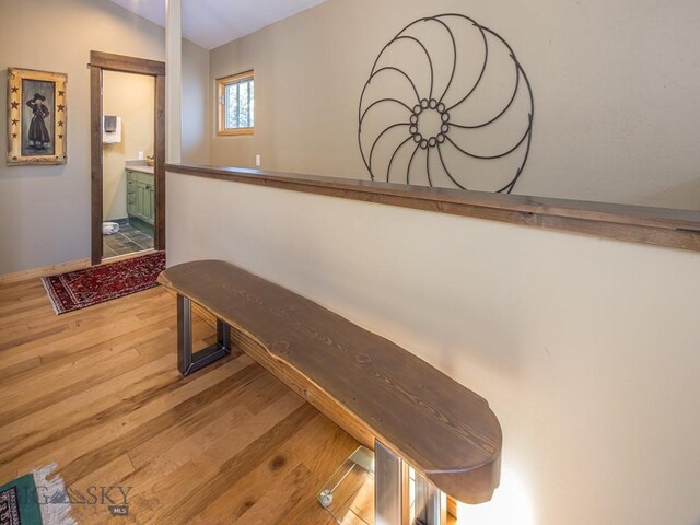 1255 Andesite Rd, Big Sky, MT 59716 - hall featuring wood finished floors and baseboards