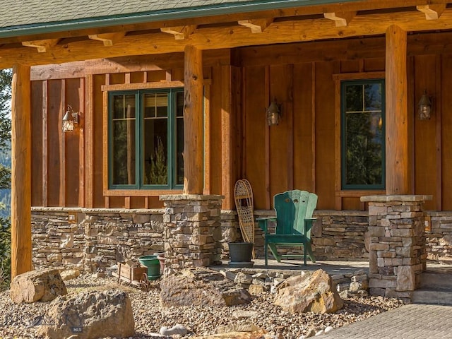 725 Sandhill Rd, Big Sky, MT 59716 - doorway to property featuring board and batten siding and stone siding