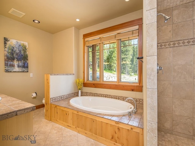 725 Sandhill Rd, Big Sky, MT 59716 - full bathroom featuring a bath, a tile shower, tile patterned flooring, vanity, and recessed lighting
