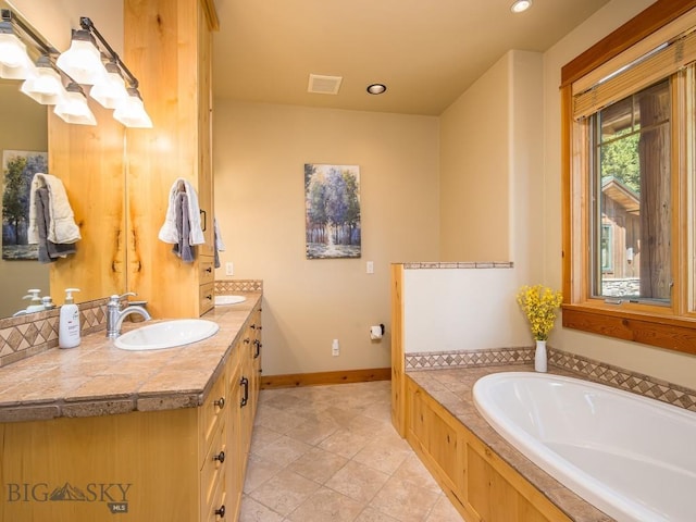 725 Sandhill Rd, Big Sky, MT 59716 - bathroom with a bath, double vanity, recessed lighting, tile patterned floors, and a chandelier