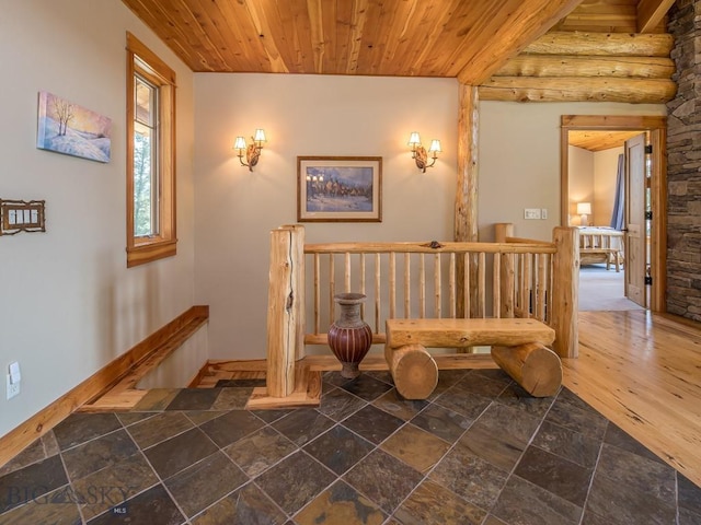 725 Sandhill Rd, Big Sky, MT 59716 - living area featuring an upstairs landing, stone tile flooring, and wood ceiling