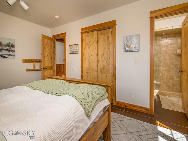 725 Sandhill Rd, Big Sky, MT 59716 - tiled bedroom featuring a closet and connected bathroom