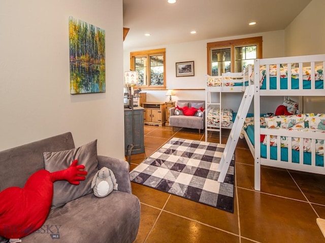 725 Sandhill Rd, Big Sky, MT 59716 - bedroom with tile patterned flooring, recessed lighting, and multiple windows
