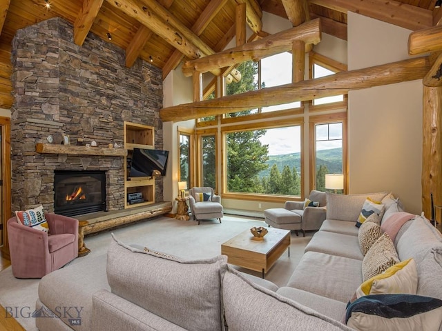 725 Sandhill Rd, Big Sky, MT 59716 - living room with a wood ceiling with exposed beams, a stone fireplace, and high vaulted ceiling
