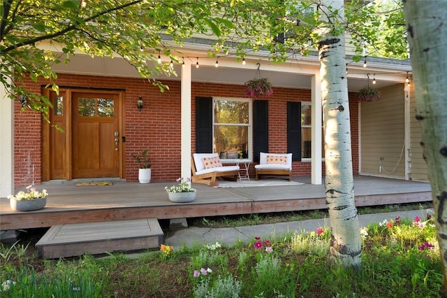 8373 Goldenstein Ln, Bozeman, MT 59715 - property entrance with brick siding and a porch