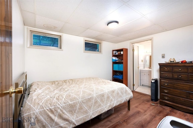 8373 Goldenstein Ln, Bozeman, MT 59715 - bedroom featuring a drop ceiling, wood finished floors, and ensuite bathroom
