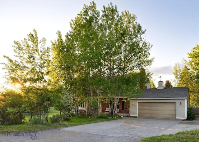 8373 Goldenstein Ln, Bozeman, MT 59715 - view of front of home with driveway and an attached garage