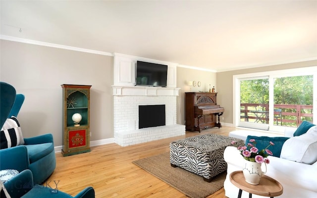 8373 Goldenstein Ln, Bozeman, MT 59715 - living area with light wood-style flooring, ornamental molding, and a fireplace
