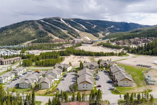 13 Moose Ridge Rd, Big Sky, MT 59716 - aerial view of property's location featuring a mountainous background and nearby suburban area