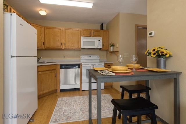 13 Moose Ridge Rd, Big Sky, MT 59716 - kitchen with white appliances, light wood-style flooring, and light countertops