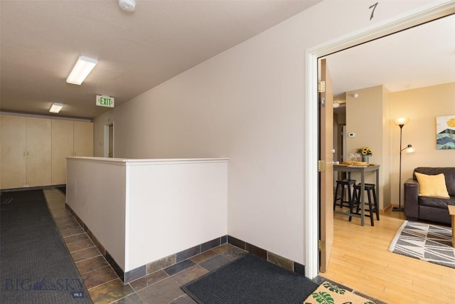 13 Moose Ridge Rd, Big Sky, MT 59716 - hall featuring baseboards and dark wood finished floors