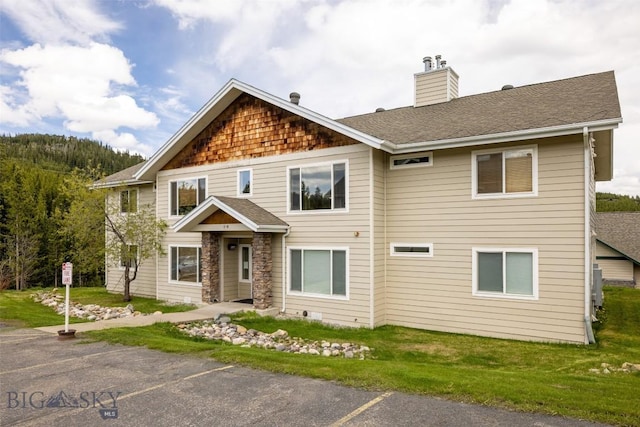 13 Moose Ridge Rd, Big Sky, MT 59716 - view of front of property featuring a chimney and a shingled roof