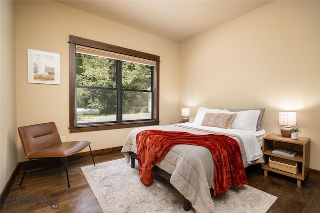13011 Cottonwood Canyon Rd, Bozeman, MT 59718 - bedroom with baseboards and dark wood-type flooring