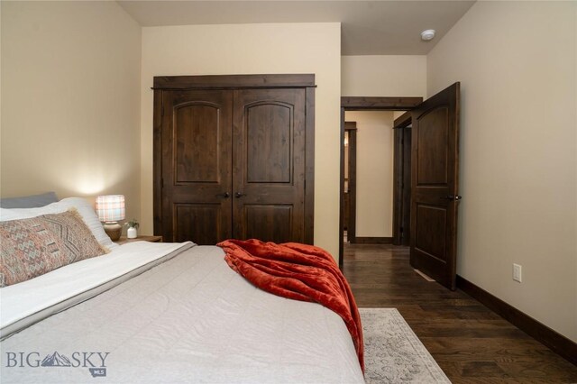 13011 Cottonwood Canyon Rd, Bozeman, MT 59718 - bedroom featuring dark wood-style flooring and baseboards