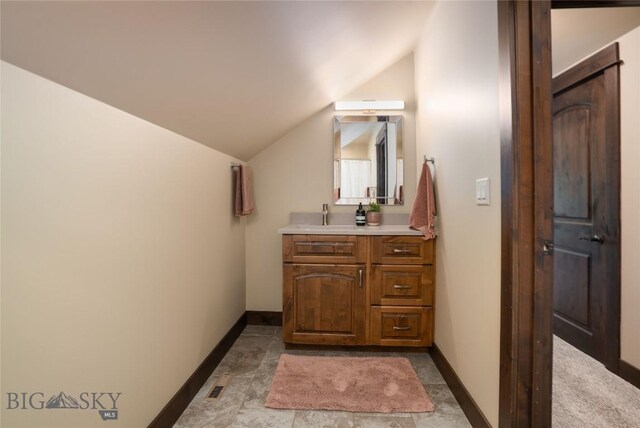 13011 Cottonwood Canyon Rd, Bozeman, MT 59718 - bathroom with vanity and lofted ceiling