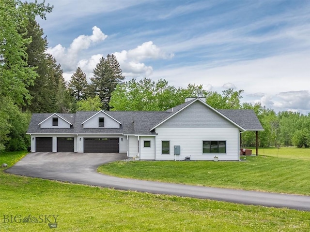 13011 Cottonwood Canyon Rd, Bozeman, MT 59718 - view of front of property featuring a front yard, driveway, an attached garage, and a shingled roof