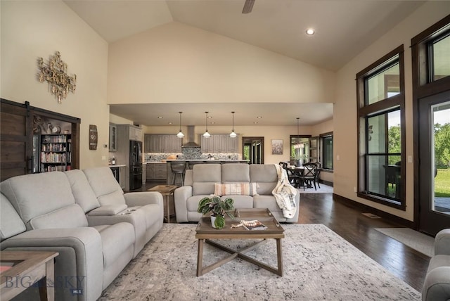 13011 Cottonwood Canyon Rd, Bozeman, MT 59718 - living room with high vaulted ceiling, dark wood-type flooring, and recessed lighting
