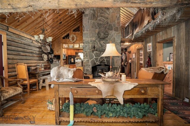13011 Cottonwood Canyon Rd, Bozeman, MT 59718 - sitting room with wood-type flooring, wooden ceiling, rustic walls, wood walls, and high vaulted ceiling