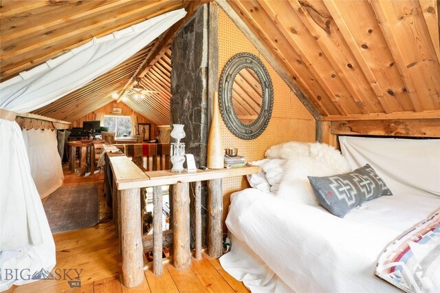 13011 Cottonwood Canyon Rd, Bozeman, MT 59718 - bedroom featuring lofted ceiling, hardwood / wood-style floors, and wood walls
