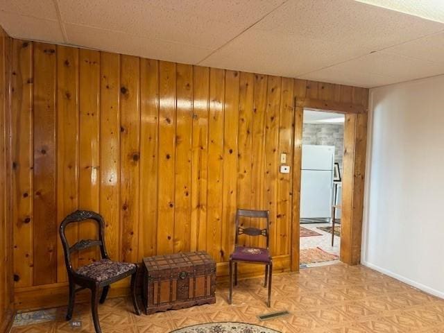 308 E 4th St, Anaconda, MT 59711 - sitting room featuring wood walls and light floors