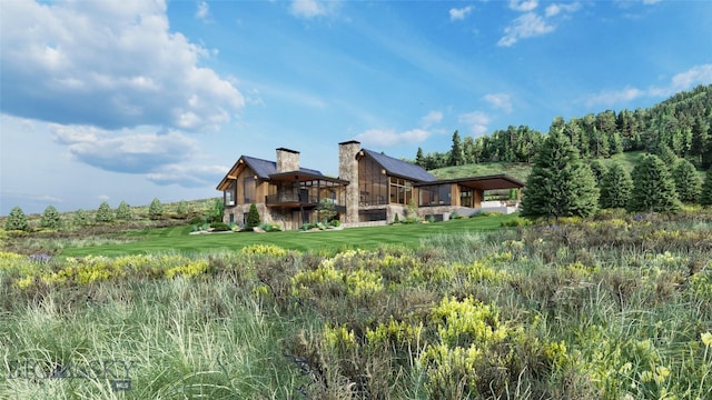 FourBarRanches Corbly Gulch, Belgrade, MT 59714 - rear view of property with a chimney and a lawn