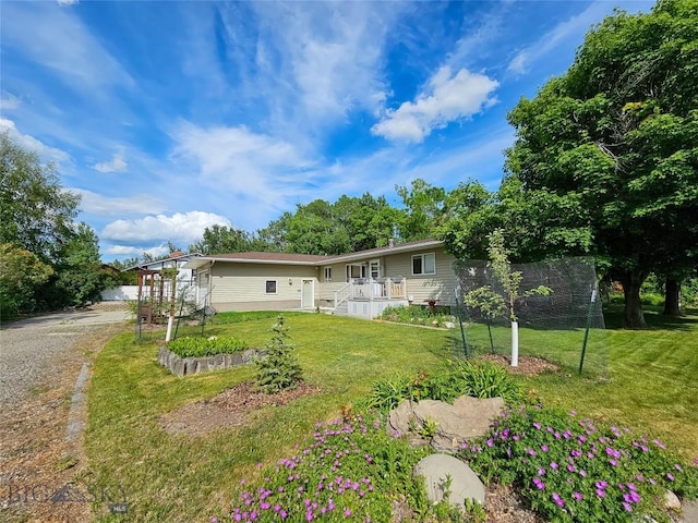 400 E 9th Ave, Big Timber, MT 59011 - rear view of house featuring a yard