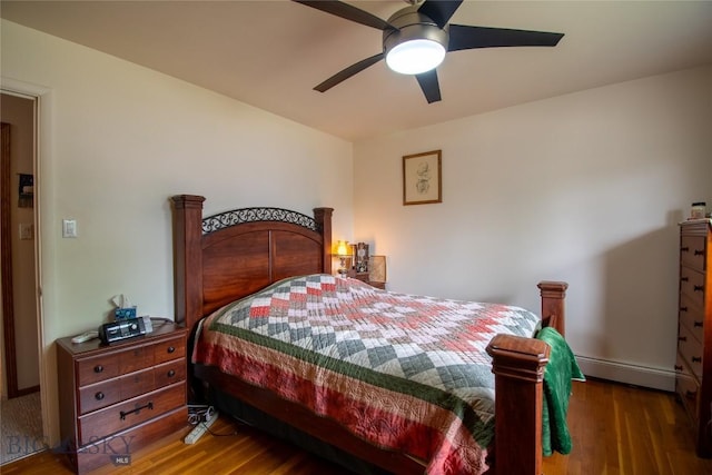 400 E 9th Ave, Big Timber, MT 59011 - bedroom with baseboard heating, wood finished floors, and ceiling fan