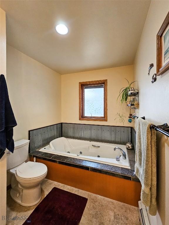400 E 9th Ave, Big Timber, MT 59011 - bathroom with a tub with jets and a baseboard heating unit