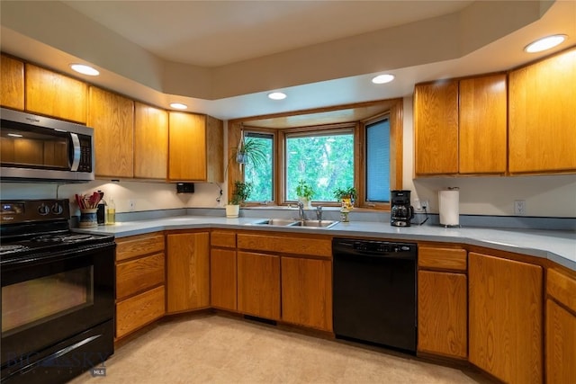 400 E 9th Ave, Big Timber, MT 59011 - kitchen with black appliances, light countertops, recessed lighting, and brown cabinetry