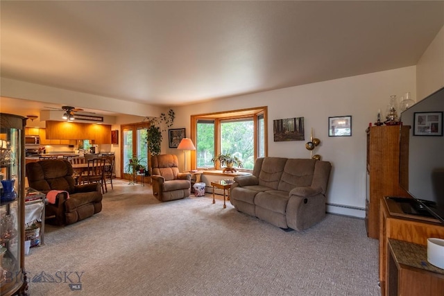 400 E 9th Ave, Big Timber, MT 59011 - living room with light carpet, baseboard heating, and a ceiling fan