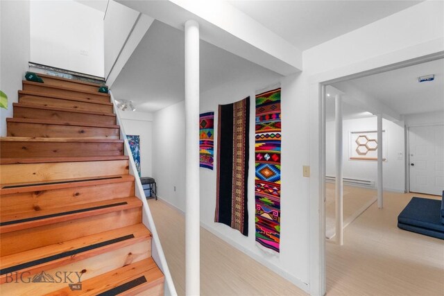 145 Spring Creek Hills Rd, Livingston, MT 59047 - stairs with baseboard heating and wood finished floors