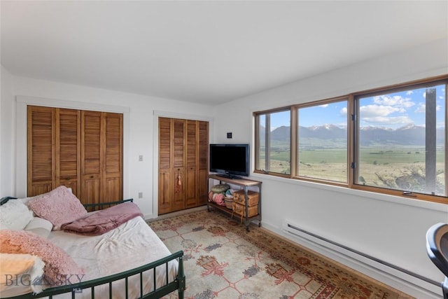 145 Spring Creek Hills Rd, Livingston, MT 59047 - bedroom featuring baseboard heating and two closets
