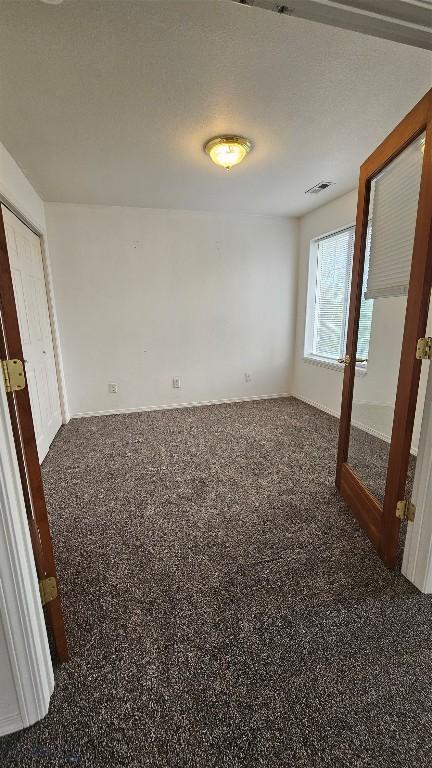 835 Forestglen Unit H, Bozeman, MT 59718 - empty room featuring carpet floors