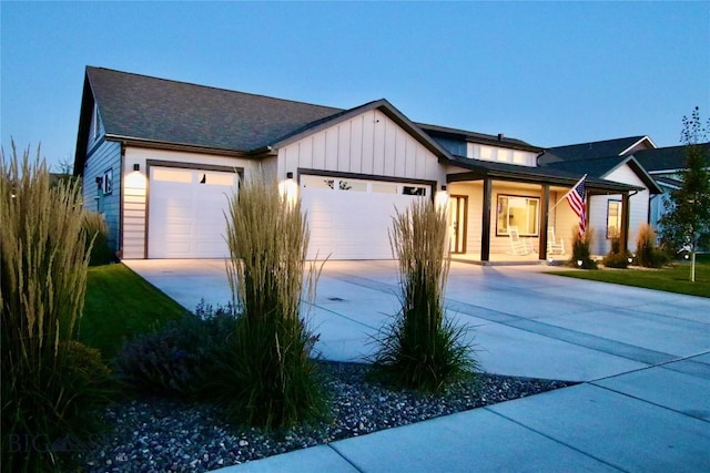 176 Travelers, Manhattan, MT 59741 - view of front of property featuring an attached garage, concrete driveway, and board and batten siding