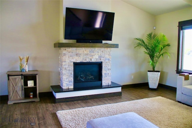 176 Travelers, Manhattan, MT 59741 - living area featuring wood finished floors and a stone fireplace