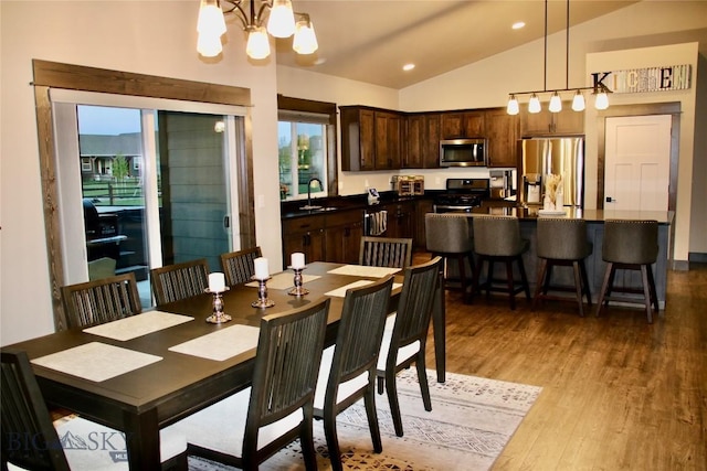 176 Travelers, Manhattan, MT 59741 - dining room with vaulted ceiling, a chandelier, light wood-type flooring, and recessed lighting